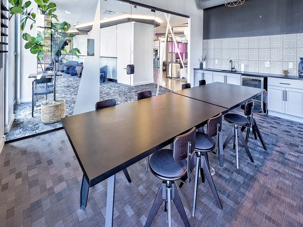 a conference room with a long table and chairs